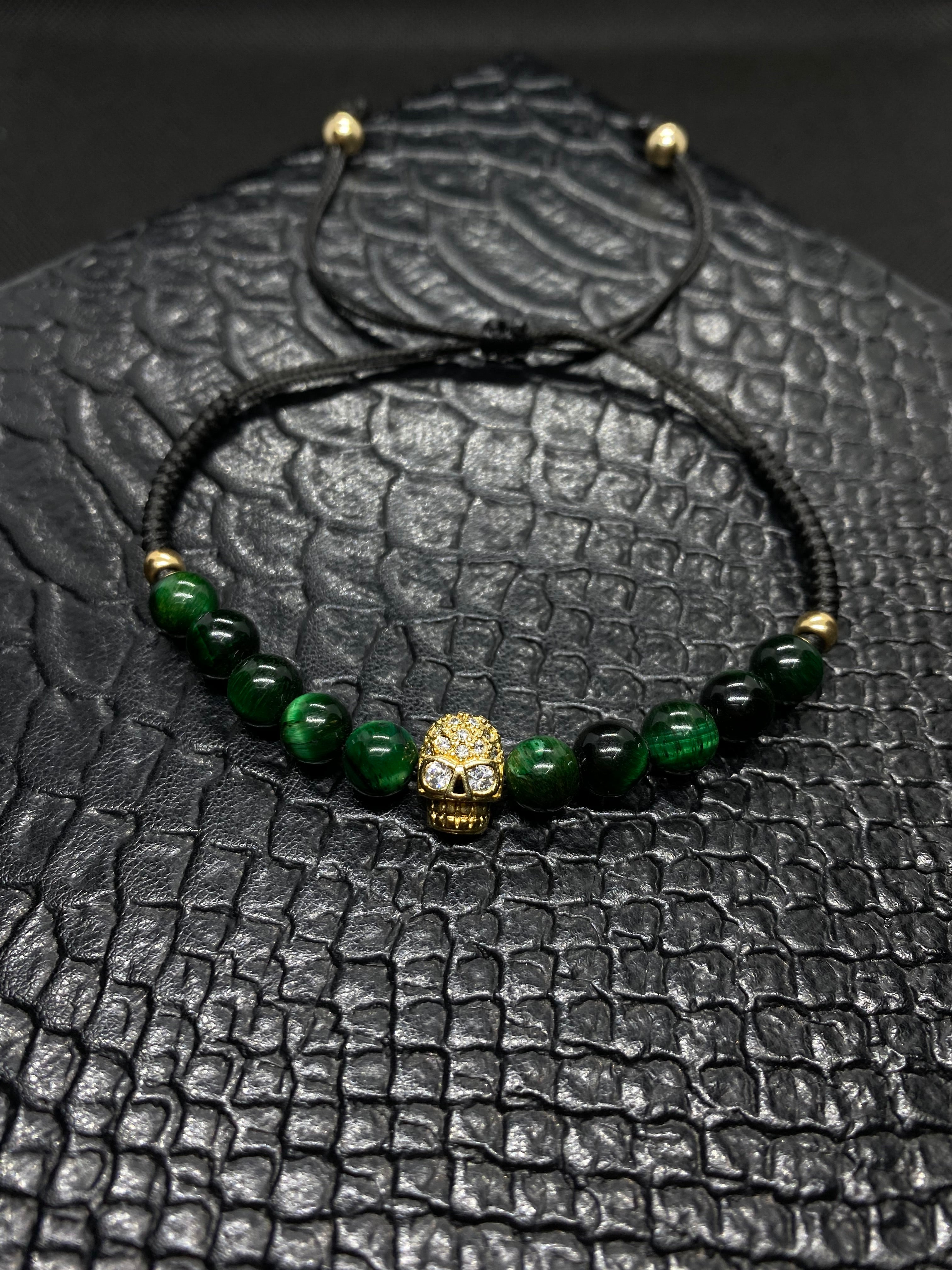 PULSERA PIEDRA OJO DE TIGRE VERDE CON CALAVERA CHAPA ORO 24K