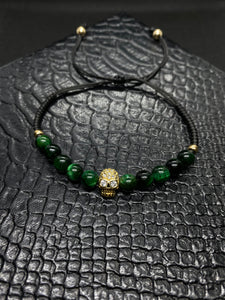 PULSERA PIEDRA OJO DE TIGRE VERDE CON CALAVERA CHAPA ORO 24K