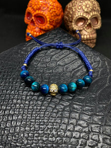 PULSERA PIEDRA OJO DE TIGRE AZUL TURQUESA CON CALAVERA CHAPA ORO 24K INCRUSTACIONES DE ZIRCONIAS